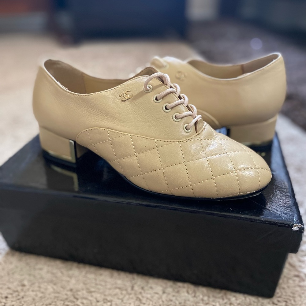 Women’s tan leather “C” mules size 6.5
